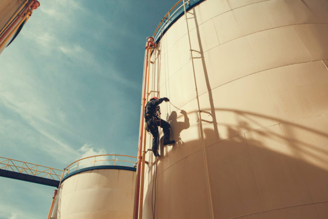 focus-view-male-worker-down-height-tank-rope-access-safety-inspection-thickness-storage-oil-gas-tank-industry