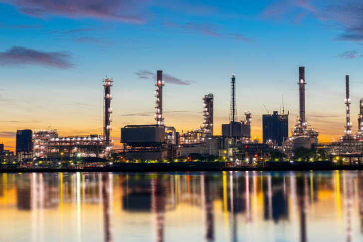 oil-gas-refinery-industry-plant-with-glitter-lighting-sunrise-morning